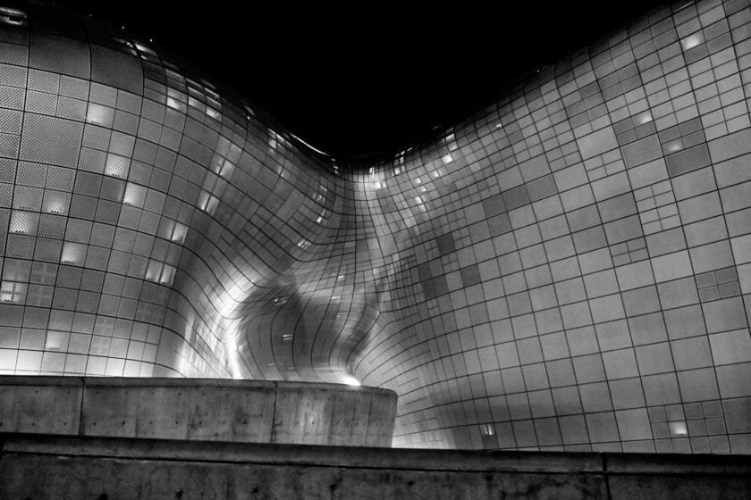 grayscale photography of glass building
