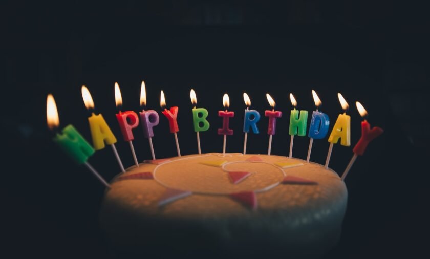 round fondant cake with happy birthday candle